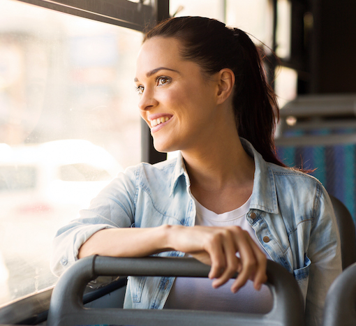 Woman on bus looking out window